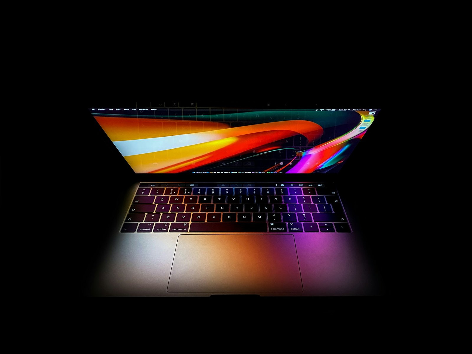 mac book pro turned on displaying red, blue and yellow lights